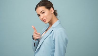 woman wearing blue shawl lapel suit jacket