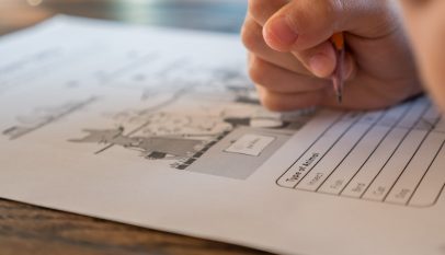 schoolchild solving elementary science test