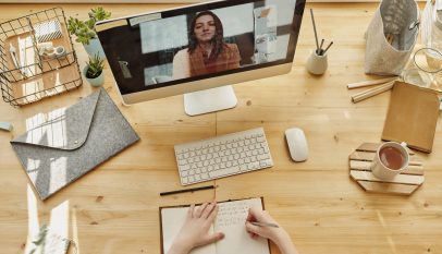 person writing on notebook