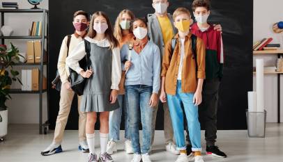 teacher and his students wearing face masks