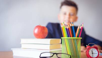 boy looking on a tidied desk