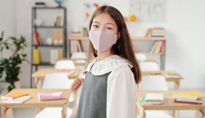girl with face mask in blurred background